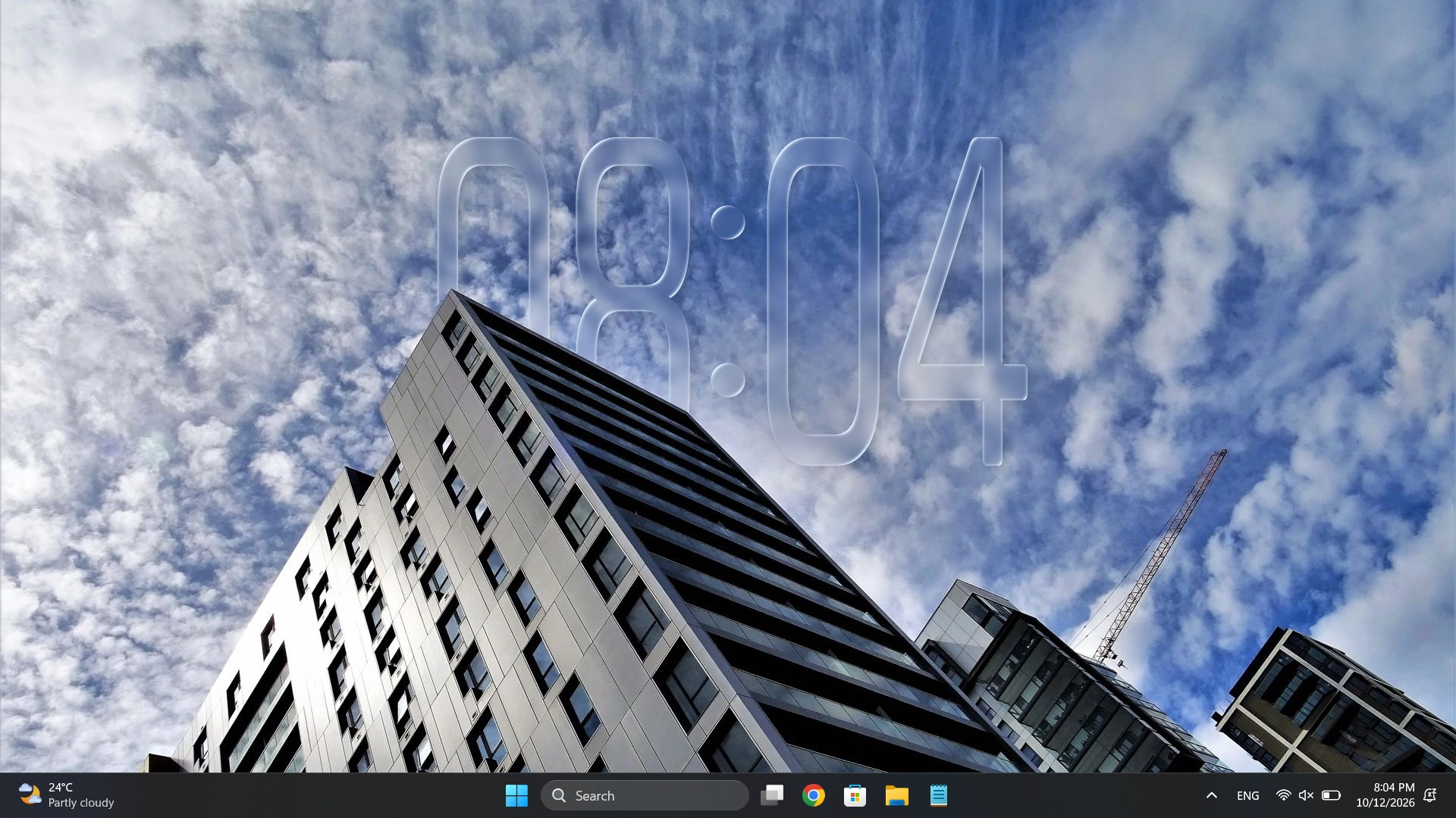 Blue desktop with glass clock behind flowing wallpaper bands